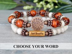 About the Bracelet Inspiring yet earthy bracelet with your choice of word. A great reminder to Just Breathe... Word Choices: Just Breathe, Strength, Journey, Love, Patience, Breathe, Namaste, Sister, Imagine, Love Life, Believe, Faith Bracelet Details: This rustic red message bracelet is made with: ♥ 8mm Rustic Red Salwag Seeds♥ 6mm Riverstone ♥ A natural wood bead engraved with "Just Breathe" ♥ Sun focal bead All items are handmade and shipped within 1-3 business days. FREE U.S. SHIPPING ON ORD Fall Jewelry Trends 2023, Boho Bracelets Hippie Chic, Red Message, Breathe Bracelet, Strength Bracelet, Love Patience, Faith Bracelet, Elastic Bracelets, Popular Bracelets