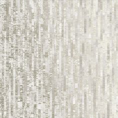 a white and grey wallpaper with vertical stripes