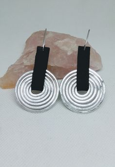 Aluminum earrings, Handmade earrings, Spiral earrings, Long aluminum earrings. Free shipping. Aluminum is a wonderful material for earrings because it is lightweight and doesn't tarnish. These spiral earrings were shaped with thick aluminum wire and black foam. Hock made from sterling silver wire. Wire Shapes, Firefly Jewelry, Aluminum Earrings, Contemporary Earrings, Spiral Earrings, Minimal Jewelry, Earrings Long, Modern Earrings, Metal Earrings