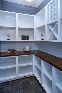 the kitchen is clean and ready for us to use it's white cupboards