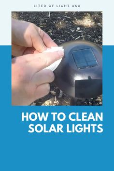 a person is cleaning a solar light on the ground with their hand and thumbnails