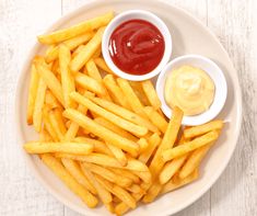 french fries with ketchup and mustard on a plate