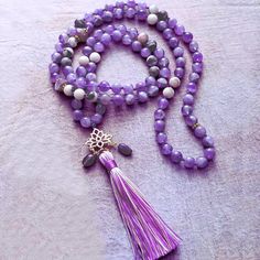 Experience the healing energy of our Hand knotted Amethyst Mala Necklace. This spiritual accessory, featuring 108 Amethyst beads, serves as a powerful tool for meditation, mantra recitation, and chakra balancing. Our Amethyst Mala is made from genuine Amethyst, a revered gemstone known for its deep purple hue and profound healing properties. This crystal is believed to possess strong cleansing abilities, promoting emotional balance, calm, and tranquility. Amethyst is also well known for its abil Meditation Mantra, Yoga Necklace, Crystal Amethyst, Mala Bead Necklace, Lotus Pendant, Bracelet Apple Watch, 108 Mala Beads, Healing Necklace, 108 Bead