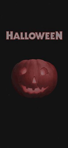 an orange pumpkin with the words halloween on it's face in front of a black background