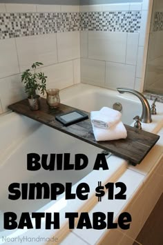 a bath tub sitting under a bathroom mirror next to a wooden tray with towels on it