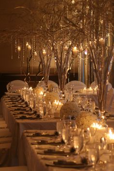 the tables are set with candles and centerpieces for an elegant dinnereone