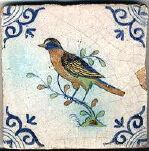 a decorative tile with two birds on it