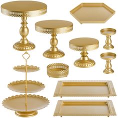 a collection of golden serving trays and plates