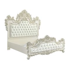 an ornate white bed frame with buttons on the headboard and foot board is shown