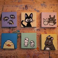 four square paintings with cartoon characters painted on them