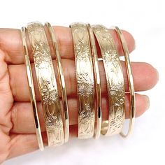 Our 7 days bangles set is make with sterling silver or 14k gold filled wire. Bangle is hand- formed, hammered into a faceted design and polished for a stunning texture and shine. It looks great worn alone or stack with other shell and charm bangles to create a chic, fun beachy look. This set come with three 8mm heirloom bangles and 4 textures bangles. Each bangle is custom made to order so can not be return or exchange for that reason. Please indicate your bangle size at checkout. If you do not Silver Bangle In 14k Gold, Silver 14k Gold Round Bangle, Adjustable Etched Round Bangle, Adjustable Etched Bangle, Custom Bangle, Charm Bangles, Faceted Design, Bangles Set, Big Pearl