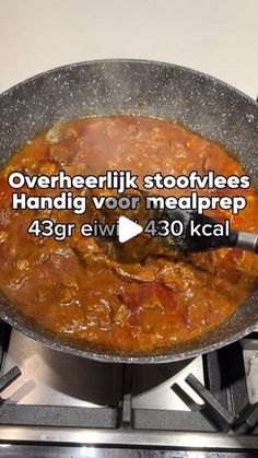 there is a large pan on the stove with food in it and words describing how to cook