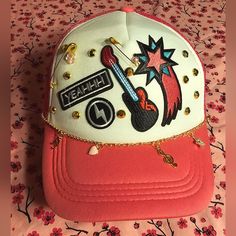 In This Listing Above: Unisex Trucker Hat Plus Add Ons: 4 Patches 1 Gold Safety Pin W/Bead 1 Gold Saftey Pin (Mini) W/Bead 1 Chain & 4 Charms Bill Bedazzled Total W/Out Shipping & Fees: $89.00 Itemized Pricing Below _________________________________ Michikokoko's Hat Bar Hat + 1 Large Bow: $35 Hat + 1 Patch: $25 Hat + 2-3 Patches: $35 Hat + 4-6 Patches: $45 Hat + 7: $55 Accessory Add On Gold Safety Pin (Mini): $2 Each Pin Gold Safety Pins: $5 Each Pin Gold Safety Pin W/Beads: $7 Each Pin Gold Sa Casual Snapback Mini Hat For Festival, Trendy Flat Brim Baseball Cap For Festivals, Casual Mini Snapback Hat For Festivals, Trendy Trucker Hat With Short Brim For Festivals, Trendy Trucker Hat For Festivals, Trendy Pink Hats For Music Festival, Trendy Short Brim Trucker Hat For Festivals, Trendy Mini Cap Hats For Festivals, Trendy Festival Mini Cap Hats