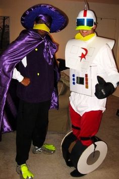 two people in costumes standing next to each other