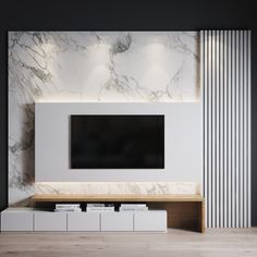 a large television mounted on the wall in a room with white walls and wooden flooring