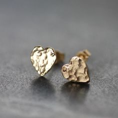 Recycled Solid 9ct Yellow Gold Heart Stud Earrings, Handmade Dainty Heart Earrings, Textured Gold Studs, Valentines Gift Available as Made To Order - please allow 1 week from order. A heart shaped version of one of my best selling gold studs.  Easy to wear, dainty & discreet, solid 9ct gold flat hammered studs. Made by melting down recycled 9ct gold in the workshop, to create individual, hand-carved organic shaped heart studs, each with a slightly different & unique hammered texture. Edges are p Gold Heart Stud Earrings, Gold Heart Studs, Gold Heart Earring, Minimalist Earrings Studs, Love And Friendship, Minimalist Studs, Solid Gold Earrings, Heart Stud Earrings, Sell Gold