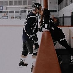 two people are kissing on the ice rink