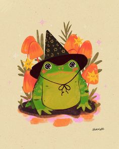 a frog wearing a witches hat sitting on the ground