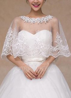 a woman wearing a white wedding dress with sheer sleeves and lace on the boler