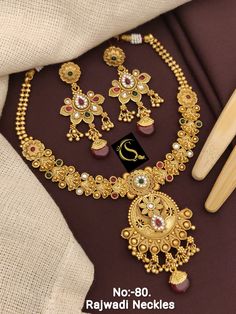 Description :- Kundan Jewelry,Gold Plated Indian Wedding Jewelry Sets,Bollywood Fashion Jewellery,Pakistani Bridal Jewelry Set,Bridal Necklace Jewelry Gift yourself a royal look with this perfectly crafted necklace set from Manalisstudio. Crafted with high quality CZ stones, it is impressive in design. The green enamel artwork adds perfect texture to the design. Perfect for weddings and festivities, this antique necklace set should be put on with your favorite sari or lehenga. 100% Satisfaction. Cheap Traditional Gold Sets, Luxury Gold Kundan Necklace For Eid, Luxury Jeweled Temple Necklace For Diwali, Antique Necklace Set, Choker Design, Indian Wedding Jewelry Sets, Pakistani Bridal Jewelry, Choker Designs, Kundan Jewelry