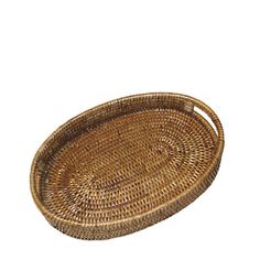 an oval wicker tray with handles on a white background for use as a serving tray