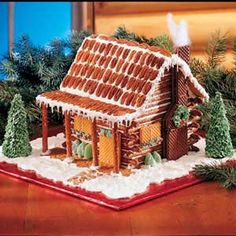 a gingerbread house decorated with icing and decorations