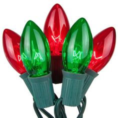 red and green christmas lights on white background