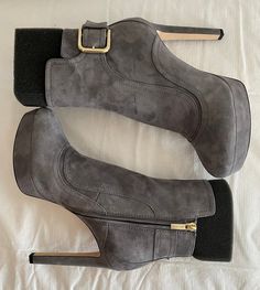 "Luscious suede ankle boots sit atop a staggering stacked heel and a subtle platform sole. Suede upper Almond toe Side zip closure Adjustable ankle buckle Leather lining Leather sole Self-covered stiletto heel, 4.5\" (115mm) Platform height, 1\" Made in Italy Previously owned but never worn. Retails new for $1050" Suede Platform Heeled Boots Medium Width, Suede Platform Boots Medium Width, Trendy Ankle-high Suede Platform Boots, Suede Ankle-high Platform Heeled Boots, Suede High-top Platform Boots With Reinforced Heel, Navy Blue Boots, Purple Floral Dress, Platform Heels Boots, Blue Boots