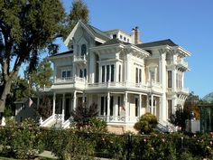 a large white house with many windows and balconies