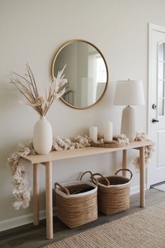 a table with two baskets under a mirror