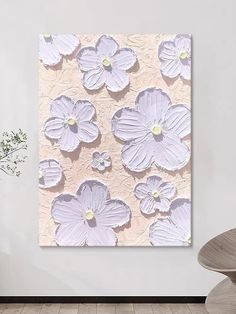 an abstract floral painting on a white wall