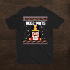 Buy Deez Nuts Nutcracker Shirt Funny Ugly Christmas Sweater Xmas Shirt at Fantasywears. Hight quality products with perfect design is available in a spectrum of colors and sizes, and many different types of shirts! Unisex T-Shirt – 100% Cotton (fiber content may vary for different colors) – Medium fabric (5.3 oz/yd² (180 g/m²)) – Classic fit – Tear away the label – Runs true to size Women T-Shirt – 100% combed ringspun cotton (fiber content may vary for different colors) – Light fabric (4.3 oz/yd² (146 g/m²)) – Slim fit with a longer body length – Tear away the label [...] Festive Winter Crew Neck Shirt, Crew Neck Shirt For Winter Festive Occasion, Festive Crew Neck Shirt With Graphic Print, Festive Crew Neck Graphic Print Shirt, Festive Graphic Print Crew Neck Shirt, Nutcracker Shirt, Funny Ugly Christmas Sweater, Deez Nuts, Ugly Christmas Sweater Funny