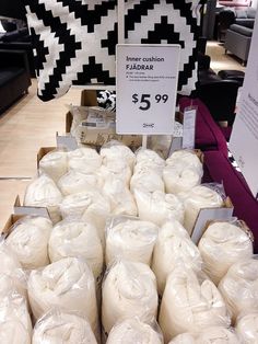 there are many bags of toilet paper on the shelf in the store for $ 5 99