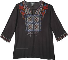 a women's blouse with flowers and geometric designs on the front, in black