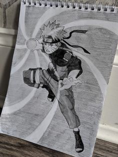 a drawing of naruto is shown on a notepad next to a wall