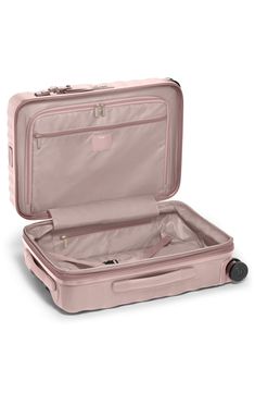 This expandable suitcase is designed with a Lever Lock System™ that allows you to pack more while still enjoying the rigid structure and durability of aluminum.Closure: The two-way zip-around closure features a low-profile, integrated TSA-approved lock with a three-digit combination dial for extra security. Tumi's patented Omega Closure System® reduces the risk of damage to the zipper and is designed to break away from the bag if it becomes caught, so the puller—rather than the entire zipper—can Mauve Texture, Tumi Bags, Commuter Backpack, Travel Laptop Backpack, Tsa Approved, Carry On Suitcase, Travel Toiletries, Travel Collection, Fabric Gift Bags