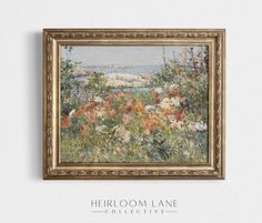 a painting hanging on the wall above a bed of wildflowers and other flowers