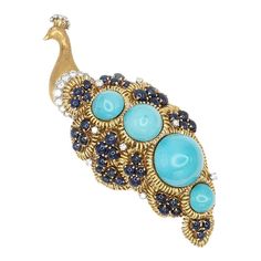 large peacock brooch with diamonds, sapphires & 4 large cabochon turquoise  Single pin closure & safety lock  Approximate Weight: Gross 65.40 grams Diamonds ~ 1.25 carats Sapphires ~ 10.0 carats  Approximate Measurement: 4.25" x 1.5" (~ 108mm x 38.1mm) Hallmarks: NA gold purity professionally tested Luxury Turquoise Jewelry Brooch, Luxury Turquoise Brooches, Elegant Peacock-colored Brooches For Wedding, Luxury Ornate Peacock Design Necklace, Luxury Ornate Gemstone Brooches, Sapphire, Turquoise, 10 Things, Gold