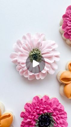 three different types of flowers on a white surface