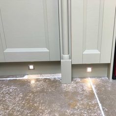 two lights that are on in the floor