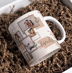 a coffee mug with family pictures on it sitting in some wood shavings,