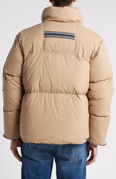 This everyday puffer jacket is made from the brand's Recycled EnduraLuxe fabric, a water-repellent fabric with a durable, soft-to-the-touch finish. As its lofty down insulation protects you from the coldest chills, this jacket's zip hand-warmer pockets, plus three interior pockets, keep all your essentials secure. Front zip closure with chin guard Down-filled stand collar Recessed rib-knit cuffs Front zip pockets; two interior mesh drop-in pockets; interior zip security pocket Reflective double- Beige Down Puffer Jacket, Beige Nylon Puffer Jacket With Padded Collar, Cold Weather Nylon Outerwear With Padded Collar, Nylon Outerwear With Padded Collar For Cold Weather, Cold Weather Nylon Parka With Padded Collar, Nylon Parka With Padded Collar For Cold Weather, Outdoor Puffer Jacket With Padded Collar And Duck Down, Outdoor Duck Down Puffer Jacket With Padded Collar, Beige Nylon Outerwear With Padded Collar