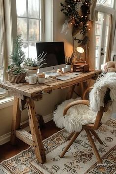 a wooden desk with a computer on top of it next to a chair and window