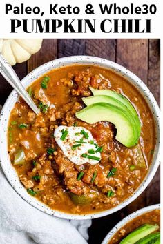 two bowls filled with chili and topped with avocado