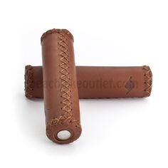 two brown leather grips on white background