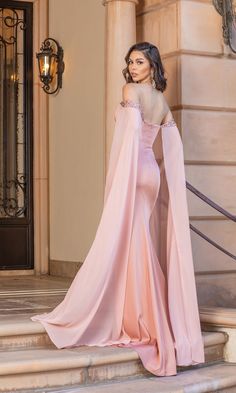 Dramatic and sultry, this off-the-shoulder prom dress boasts floor-length cape sleeves worthy of a queen. Flowing from beautifully beaded off-the-shoulder arm bands, sheer fabric flows loosely and elegantly down to the floor to create the extravagant cape sleeves. Additional beading accents the top of the side slit on this long-sleeve formal prom dress. Hugging the curves from the sweetheart neckline through the hips, this tight prom dress offers a body-contouring silhouette. You'll be making a Red Pageant Gowns, Gown With Cape, Tight Prom Dresses, Cape Sleeve Dress, Pageant Gown, Shoulder Cape, Long Sleeve Prom, Body Measurement, Pageant Gowns