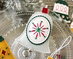 an ornament is sitting on top of a glass plate