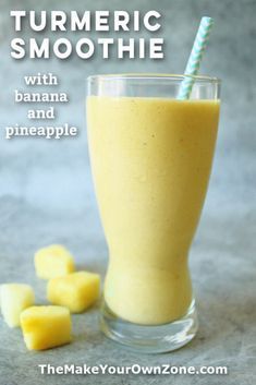 a glass filled with banana and pineapple smoothie