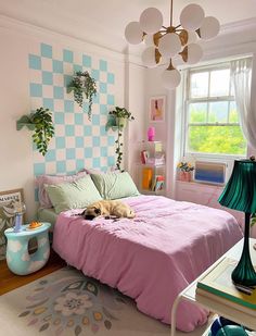 a dog laying on a bed in a bedroom