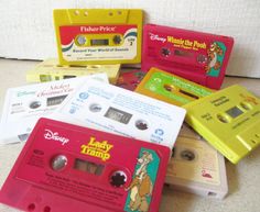 there are many different colored cassettes on the floor